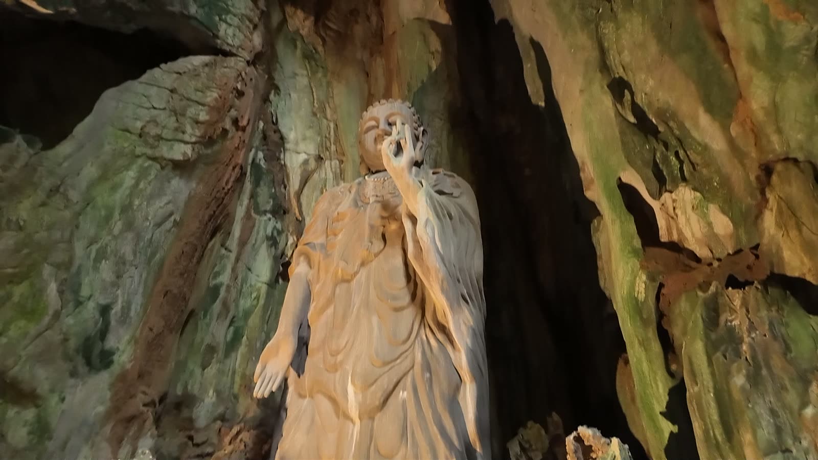 A figure carved into the cave wall at the Marble Mountains, Da Nang