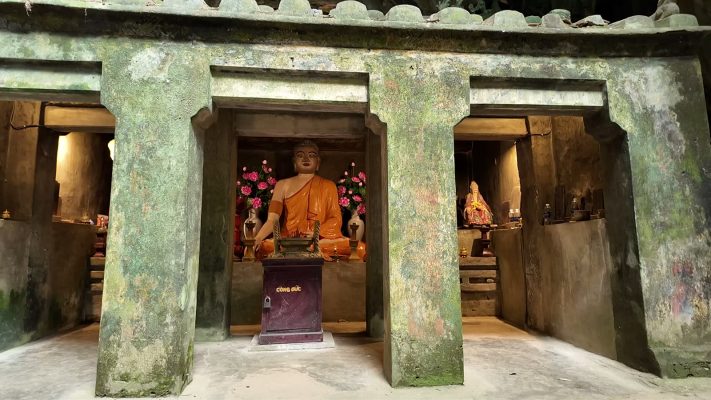 A shrine set between stone pillars inside one of the caves at the Marble Mountains, Da Nang